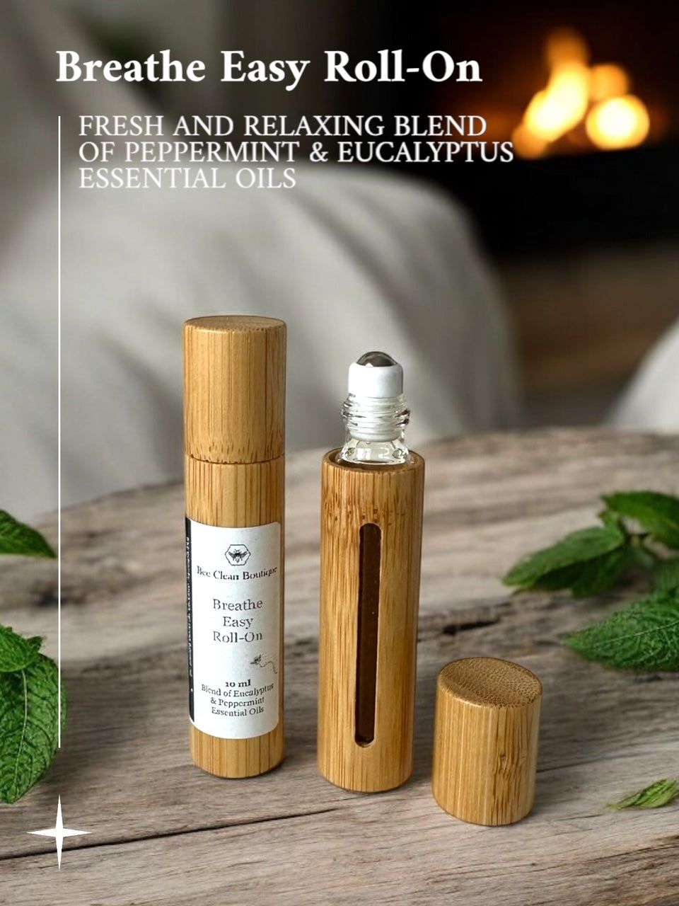 Breath Easy essential oil rollers in bamboo vessel on wooden surface surrounded by mint leaves