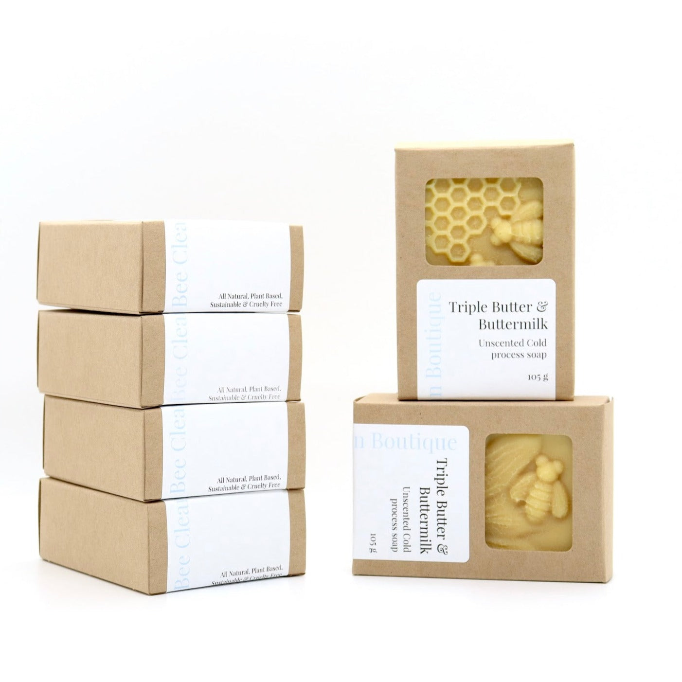 2 stacks of triple butter and buttermilk bar soaps in kraft paper boxes displayed on a white surface