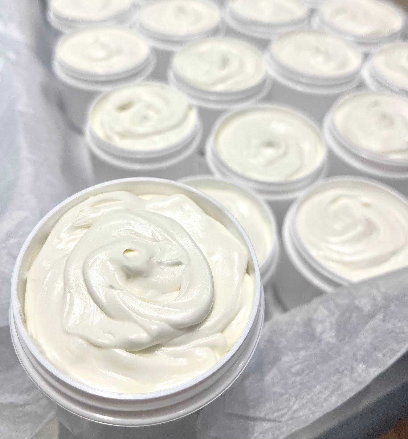 cocoa shea butter souffle in containers on display