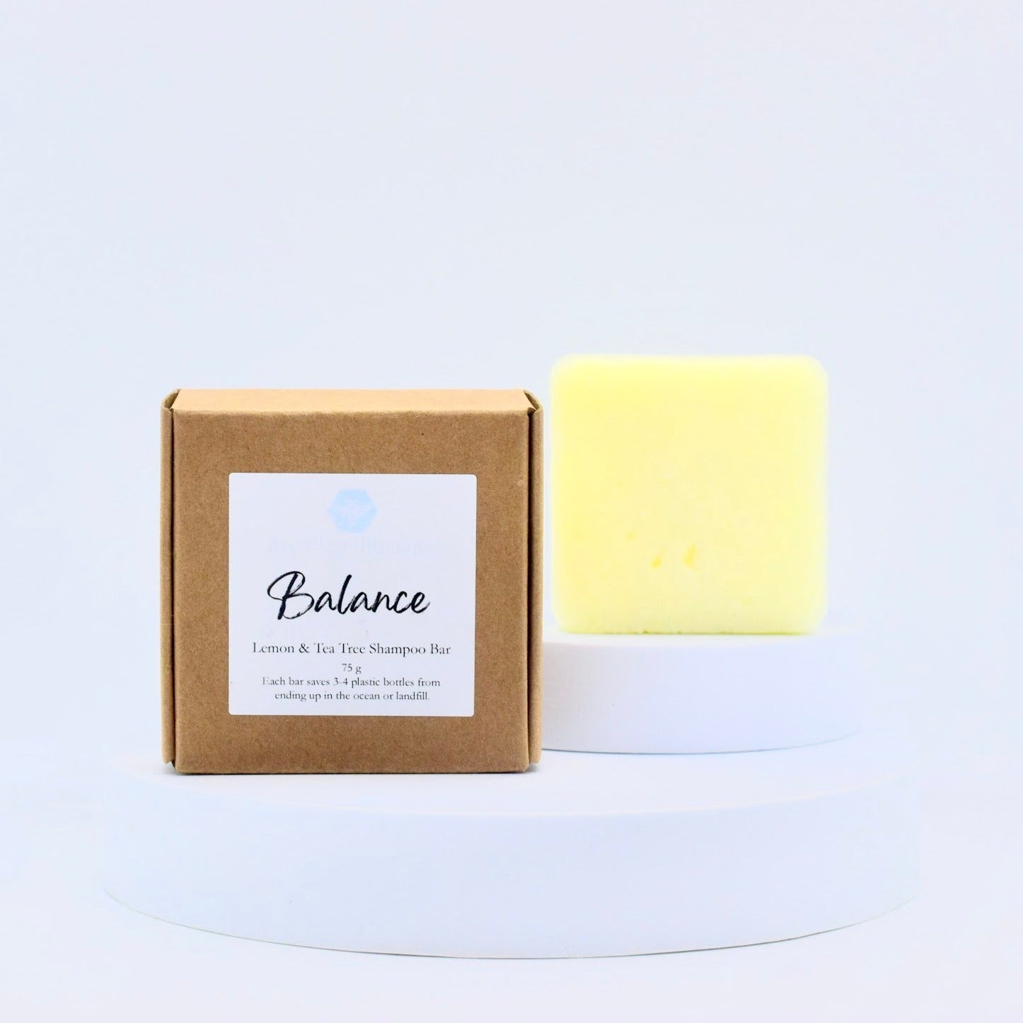 Balance shampoo bar on display on white platform