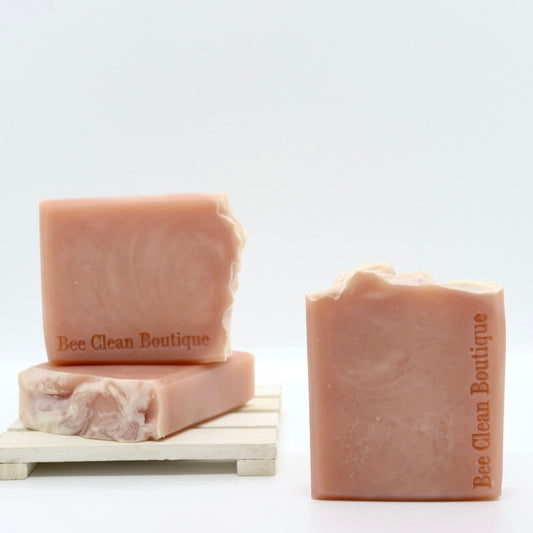 3 bars of raspberry vanilla handmade soaps on display on a white surface