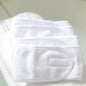 White terry cloth headbands folded in a stack